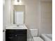A full bathroom with modern vanity, white countertops, and shower with tile surround at 1829 Hislop Ln, Atlanta, GA 30345