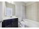 Bathroom with modern vanity, white countertops, and shower with tile surround at 1829 Hislop Ln, Atlanta, GA 30345