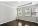 Bright bedroom features a trey ceiling, hardwood floors, and bright windows offering ample natural light at 1829 Hislop Ln, Atlanta, GA 30345
