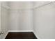 Walk-in closet with wire shelving and dark wood-look flooring providing ample storage space at 1829 Hislop Ln, Chamblee, GA 30345