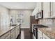 Kitchen featuring granite countertops, stainless steel appliances, and ample cabinet space at 1829 Hislop Ln, Atlanta, GA 30345