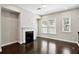 Bright living room featuring a fireplace, hardwood floors, and large windows offering ample natural light at 1829 Hislop Ln, Atlanta, GA 30345