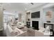Bright living room featuring a fireplace, modern decor, and seamless open-concept design at 1829 Hislop Ln, Atlanta, GA 30345