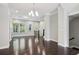 Open-concept living room with hardwood floors, lots of windows and a modern fireplace at 1829 Hislop Ln, Atlanta, GA 30345