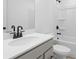Bathroom featuring white countertop, basin sink, and shower at 3190 Eastham Run Dr, Dacula, GA 30019