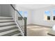 Modern staircase with sleek railings and hardwood steps at 3190 Eastham Run Dr, Dacula, GA 30019