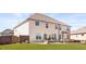 Large backyard featuring a patio with outdoor seating and a manicured lawn at 3314 Ridge Manor Way, Dacula, GA 30019