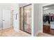 Modern bathroom features a tiled walk-in shower with glass door and adjacent walk-in closet at 3314 Ridge Manor Way, Dacula, GA 30019