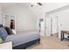 Bedroom with white walls, neutral carpeting, and ensuite bathroom at 3314 Ridge Manor Way, Dacula, GA 30019