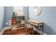 Bedroom with a window, desk, storage shelves, hardwood floors, and light blue walls at 3314 Ridge Manor Way, Dacula, GA 30019