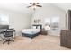 Bright bedroom with neutral walls, carpeted floor, and a large window at 3314 Ridge Manor Way, Dacula, GA 30019