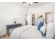 Bedroom boasts a walk-in closet, ensuite bathroom, ceiling fan, and stylish decor at 3314 Ridge Manor Way, Dacula, GA 30019