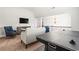 Upstairs Bonus Room with oversized couch, air hockey table and television at 3314 Ridge Manor Way, Dacula, GA 30019