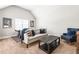 Upstairs Bonus Room offers an oversized couch, air hockey table, and blue accent chair at 3314 Ridge Manor Way, Dacula, GA 30019