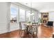 Cozy dining area with natural light, fireplace, and hardwood floors at 3314 Ridge Manor Way, Dacula, GA 30019