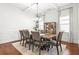 Bright dining room features hardwood floors, a coffered ceiling, and an elegant chandelier at 3314 Ridge Manor Way, Dacula, GA 30019