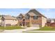 Charming two-story brick home featuring a manicured lawn and a two-car garage at 3314 Ridge Manor Way, Dacula, GA 30019