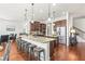 Spacious kitchen features a breakfast bar, stainless appliances, granite countertops, and hardwood flooring at 3314 Ridge Manor Way, Dacula, GA 30019