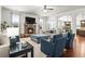Inviting living room featuring fireplace, large windows, and comfortable seating at 3314 Ridge Manor Way, Dacula, GA 30019