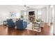 Bright living room with a cozy fireplace, plush seating, and hardwood floors at 3314 Ridge Manor Way, Dacula, GA 30019