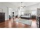 Spacious main bedroom with hardwood floors, a fireplace and sitting area, and plenty of natural light at 3314 Ridge Manor Way, Dacula, GA 30019