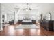 Spacious main bedroom featuring a vaulted ceiling, sitting area with fireplace, and dual dressers at 3314 Ridge Manor Way, Dacula, GA 30019
