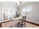 Inviting home office features French doors, neutral paint, large window and a ceiling fan at 3314 Ridge Manor Way, Dacula, GA 30019