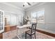 Inviting home office features French doors, neutral paint, large window and a ceiling fan at 3314 Ridge Manor Way, Dacula, GA 30019