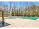 Community pool with a green pool cover at 3314 Ridge Manor Way, Dacula, GA 30019