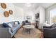 Comfortable sitting room with fireplace, plush furniture, and plenty of natural light at 3314 Ridge Manor Way, Dacula, GA 30019