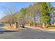 Street entrance with landscaped median and brick pillars leading to 'The Preserve at Hopkins Ridge' community at 3314 Ridge Manor Way, Dacula, GA 30019