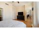 Well-lit bedroom with a TV and hardwood floors, offering a comfortable and inviting space at 57 Forsyth Nw St # 16D, Atlanta, GA 30303
