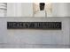 Exterior view of the 'Healey Building' sign on a stone wall at 57 Forsyth Nw St # 16D, Atlanta, GA 30303