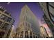 Striking low angle view of the tall building showing the facade and surrounding street at dusk at 57 Forsyth Nw St # 16D, Atlanta, GA 30303