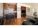 Cozy living room featuring hardwood floors, a built-in entertainment center, and open access to the kitchen at 57 Forsyth Nw St # 16D, Atlanta, GA 30303