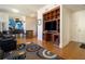 Open-concept living room with hardwood floors and open layout to the kitchen at 57 Forsyth Nw St # 16D, Atlanta, GA 30303