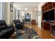 Cozy living room featuring hardwood floors, bright windows, and stylish decor at 57 Forsyth Nw St # 16D, Atlanta, GA 30303