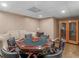 Basement game table with seating and a cabinet at 8531 N Shore Dr, Jonesboro, GA 30236