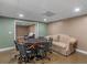 Finished basement offers space for entertaining with a game table and comfortable seating at 8531 N Shore Dr, Jonesboro, GA 30236