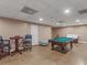 Finished basement with a pool table and seating area at 8531 N Shore Dr, Jonesboro, GA 30236