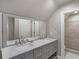 Bright bathroom featuring marble countertop, grey cabinets, and walk-in shower at 8531 N Shore Dr, Jonesboro, GA 30236