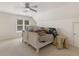 Bright bedroom with ceiling fan and window at 8531 N Shore Dr, Jonesboro, GA 30236
