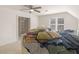 Bright bedroom with a ceiling fan, closet, and natural light at 8531 N Shore Dr, Jonesboro, GA 30236