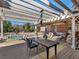 Spacious deck with a pergola, comfortable seating, dining area, and pool views for outdoor relaxation at 8531 N Shore Dr, Jonesboro, GA 30236