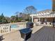 Enjoy outdoor living on this large deck, perfect for dining and overlooking the pool at 8531 N Shore Dr, Jonesboro, GA 30236