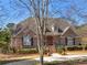 Charming brick home with a manicured lawn, mature trees, and inviting curb appeal at 8531 N Shore Dr, Jonesboro, GA 30236
