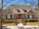 Attractive brick home featuring a classic design, landscaped yard, and a welcoming entrance at 8531 N Shore Dr, Jonesboro, GA 30236