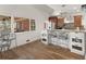 Bright kitchen featuring updated countertops, custom cabinetry, eat-in bar, and natural light from the large window at 8531 N Shore Dr, Jonesboro, GA 30236