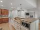 Spacious kitchen with granite countertops, stainless steel appliances, and a serving area overlooking the great room at 8531 N Shore Dr, Jonesboro, GA 30236