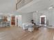 Expansive living room with hardwood floors, open floor plan, and seamless transition to kitchen and dining area at 8531 N Shore Dr, Jonesboro, GA 30236